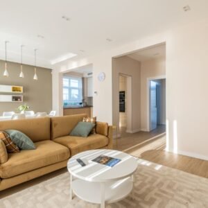 Bright and spacious living room with a modern design featuring a stylish sofa and elegant decor.
