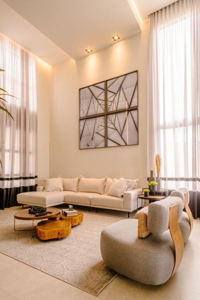Projects Stylish modern living room with high ceilings, minimalist decor, and neutral palette.